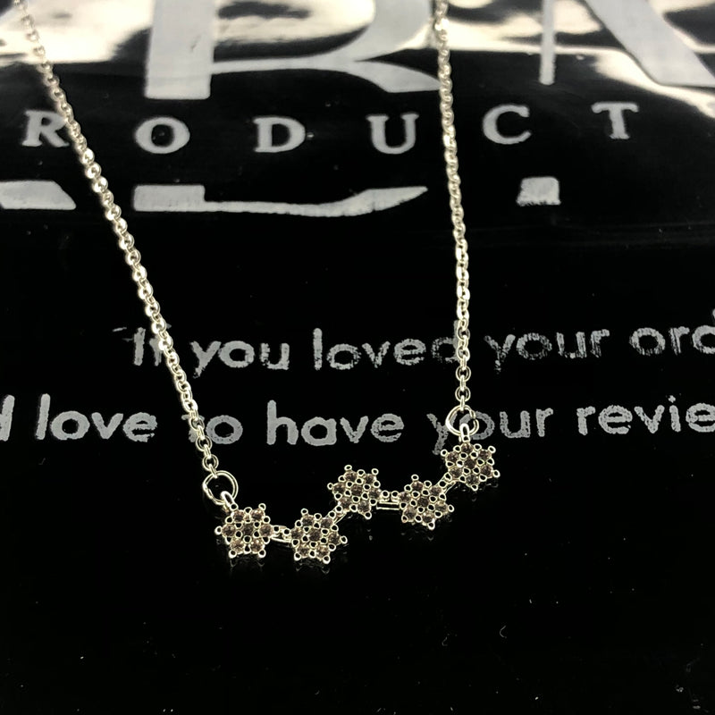 Silver floral star pendant