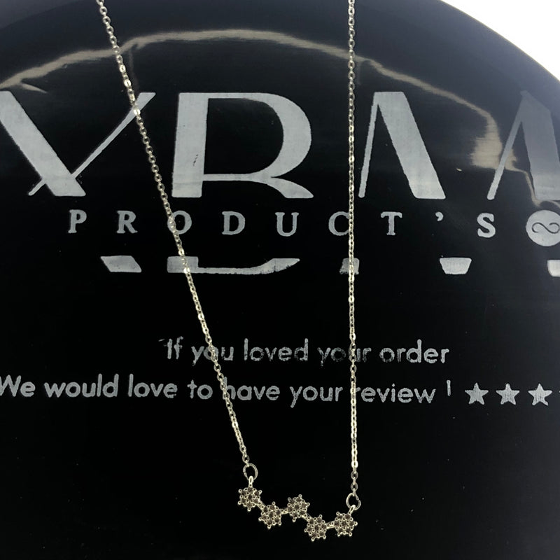 Silver floral star pendant