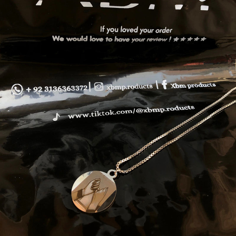 Engraved coin locket