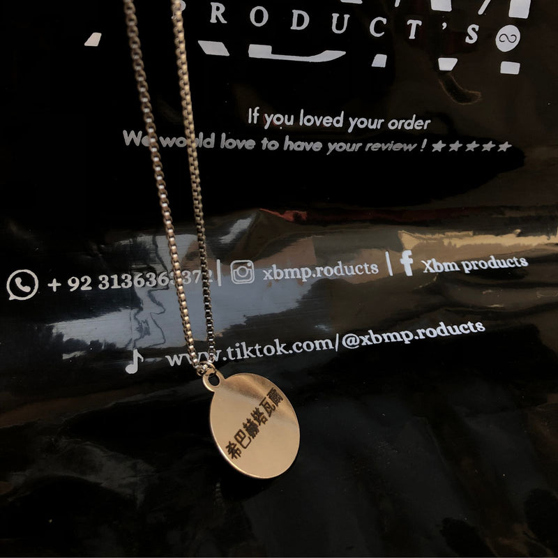 Engraved coin locket
